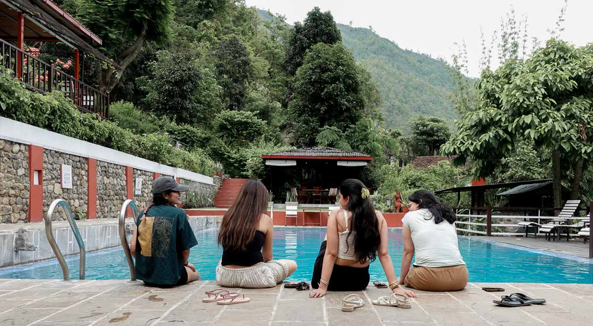 A sit beside the pool of Summit River Lodge